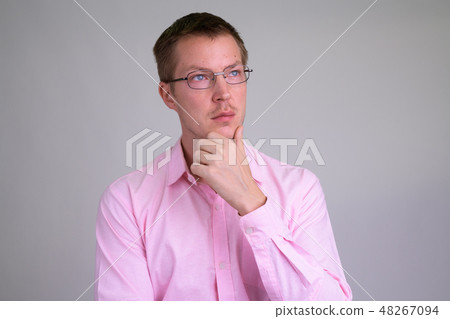 Face of young handsome businessman thinking with eyeglasses 48267094