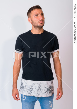 Handsome bearded Persian man thinking and looking up against white background 48267687