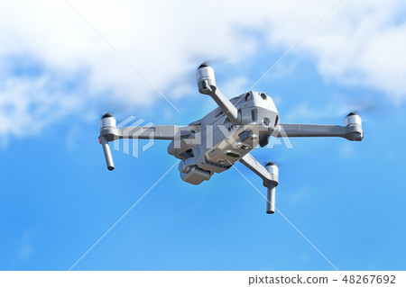 Compact drone in flight Compact drone in flight 48267692