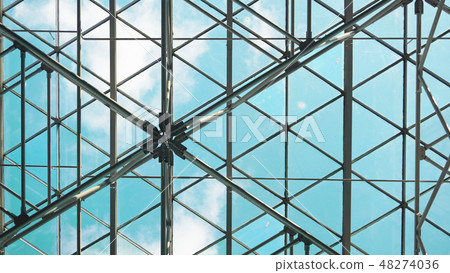 Structure of steel roof frame for building construction on sky background 48274036