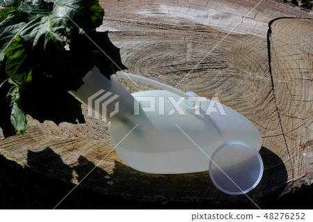 Plastic urinal used as flowers pot. Plastic urinal used as flowers pot. 48276252