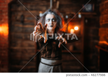 Scary witch hands out, front view 48277986