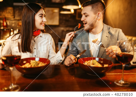 Couple at wooden bar counter, romantic dinner 48278010