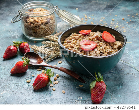 Homemade granola with ripe strawberries Homemade granola with ripe strawberries 48279541