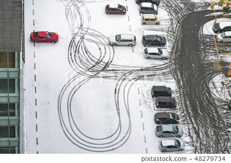 Snowy parking lot 48279734