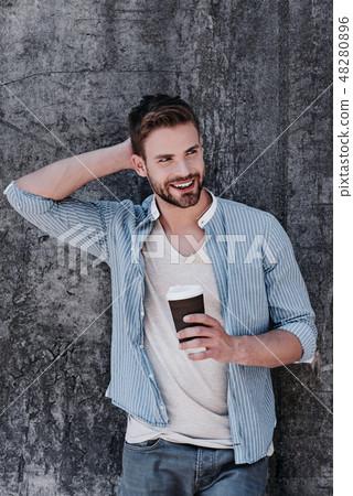 To help have less stress, take time to relax. Sexy brown-haired man with blue eyes standing isolated 48280896