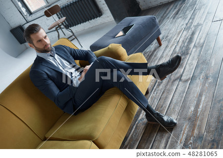 Stylish young man in a suit and bow tie. Business style. Fashionable image. Evening dress. Sexy man 48281065