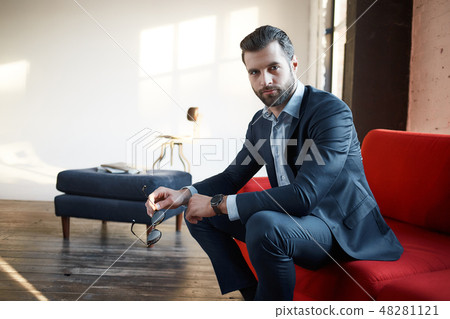 Stylish young man in a suit and bow tie. Business style. Fashionable image. Evening dress. Stylish young man in a suit and bow tie. Business style. Fashionable image. Evening dress. 48281121