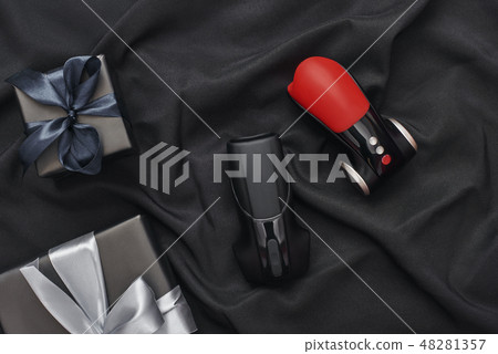 Add variety to your sex life! Close-up photo of sex toys in minimal design and gift boxes arranged 48281357