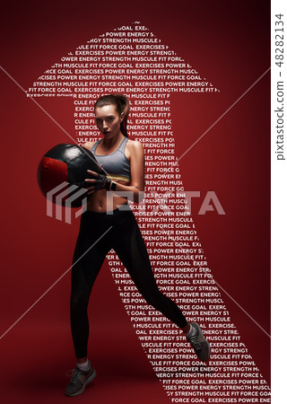 Power and beauty. Sportswoman jumping with a ball over red background 48282134