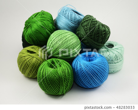 a lot of skeins of wool on a white a lot of skeins of wool on a white 48283033