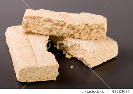 peanut halva on a dark background closeup 48283685