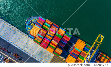 Container cargo freight ship with working crane 48283763