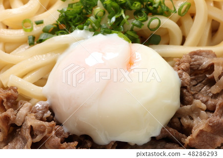 Hot spring egg topped with beef bukkake noodles. 48286293