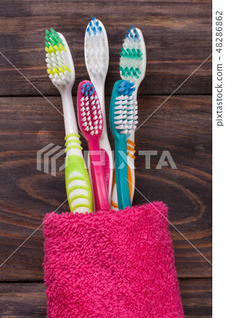 toothbrushes on the black wooden background toothbrushes on the black wooden background 48286862