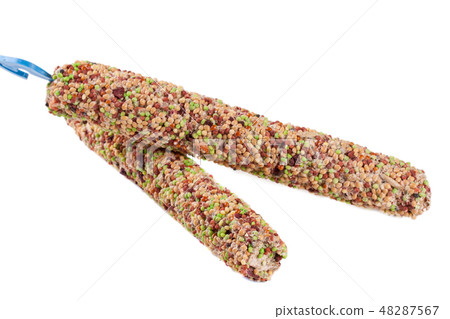 food for parrots on a stick isolated white background 48287567