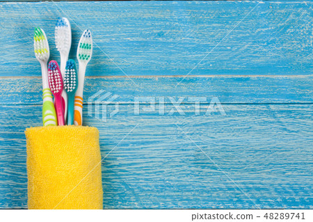toothbrushes on the blue wooden background with copy space for your text. Top view 48289741