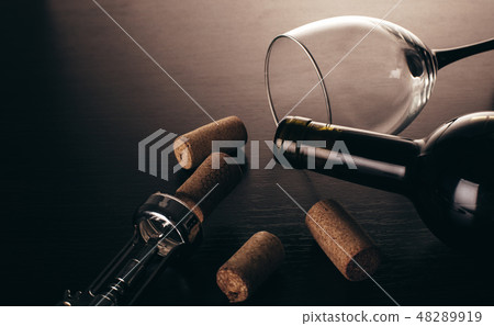 bottle of wine and corkscrew 48289919