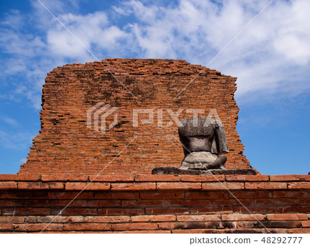 Buddha statue of Ayutthaya remains in Thailand and blue sky 48292777