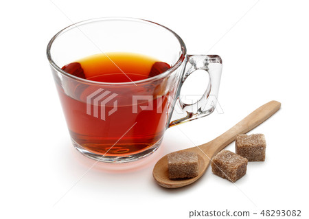 Tea in a glass cup and sugar cube isolated 48293082