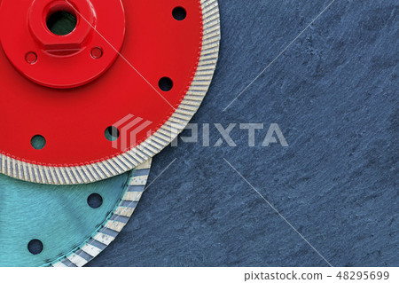 Several diamond cutting wheels against background 48295699