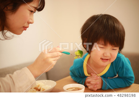 A boy who does not like vegetables 48298198