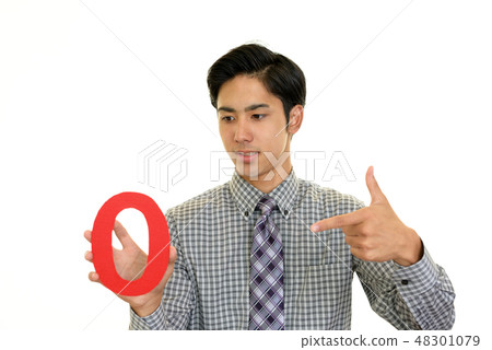A smiling businessman with numbers A smiling businessman with numbers 48301079