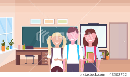 pupils with backpack holding books schoolboy and schoolgirls standing together education knowledge 48302722