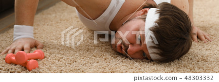 A young handsome man with excess weight 48303332