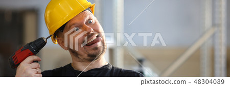 Idiot worker using electric drill portrait 48304089
