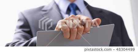 Hand of businessman in suit filling and 48304499