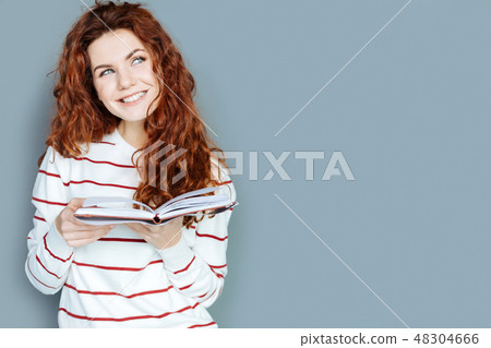 Cheerful dreamy woman smiling 48304666