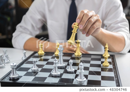 Planning and Strategic concept, Businessman playing chess and th Planning and Strategic concept, Businessman playing chess and th 48304746