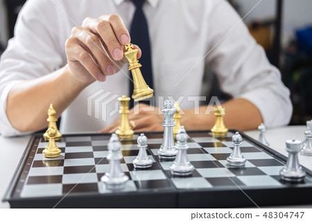 Planning and Strategic concept, Businessman playing chess and th Planning and Strategic concept, Businessman playing chess and th 48304747