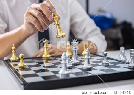 Planning and Strategic concept, Businessman playing chess and th Planning and Strategic concept, Businessman playing chess and th 48304748