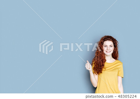 Happy red haired woman smiling to you 48305224
