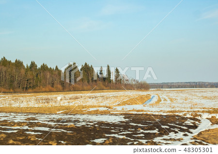 Winter sunny landscape, field forest and houses Winter sunny landscape, field forest and houses 48305301