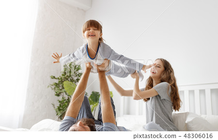 happy family mother, father and child in bed happy family mother, father and child in bed 48306016