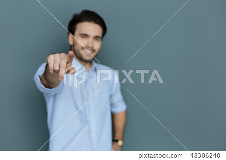 Selective focus of a male finger Selective focus of a male finger 48306240