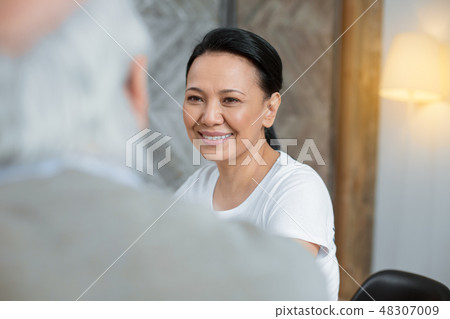 Asian volunteer supporting senior man 48307009