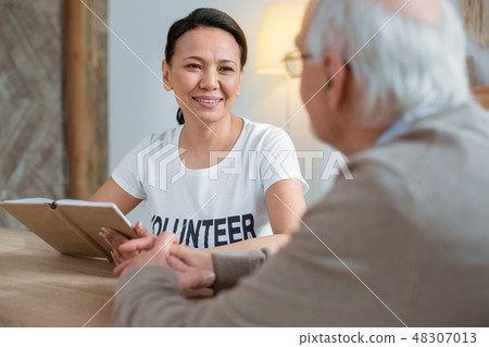 Pleased volunteer doing her job 48307013