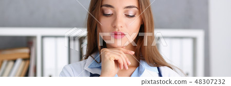 Beautiful smiling female doctor stand in office Beautiful smiling female doctor stand in office 48307232