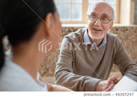Volunteer and joyful senior man sharing thoughts 48307247