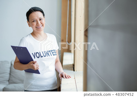 Energetic female volunteer serving nation Energetic female volunteer serving nation 48307452