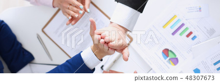 Group of people in suits crossed hands Group of people in suits crossed hands 48307673