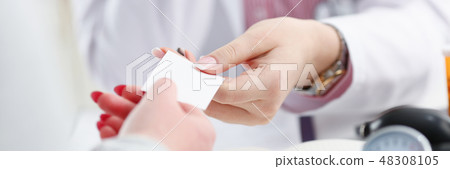 Female physician hand give white blank 48308105