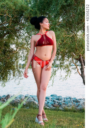 Beautiful african american girl in knitted swimsuit 48308252