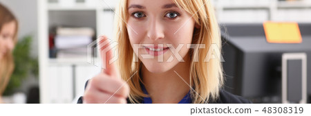 Beautiful smiling woman showing OK 48308319