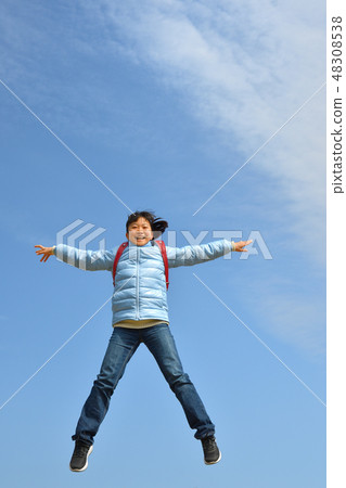 A girl who jumps in the blue sky (school bag) A girl who jumps in the blue sky (school bag) 48308538