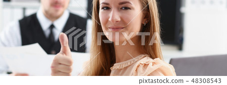 Beautiful smiling woman showing OK Beautiful smiling woman showing OK 48308543